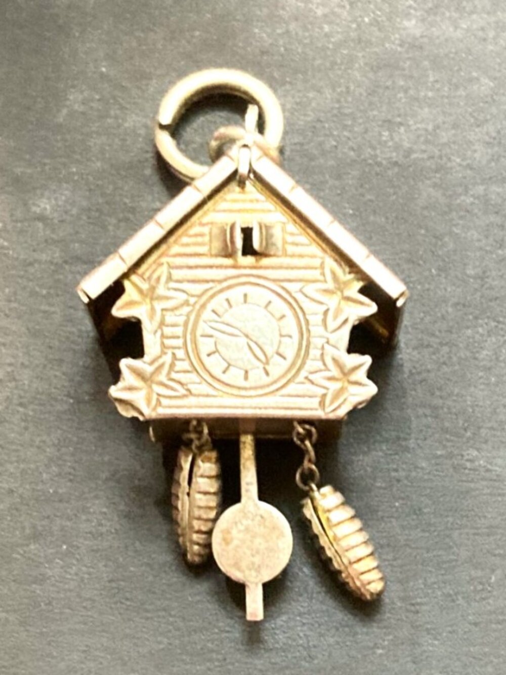 Detailed cuckoo clock pendant charm in solid silver